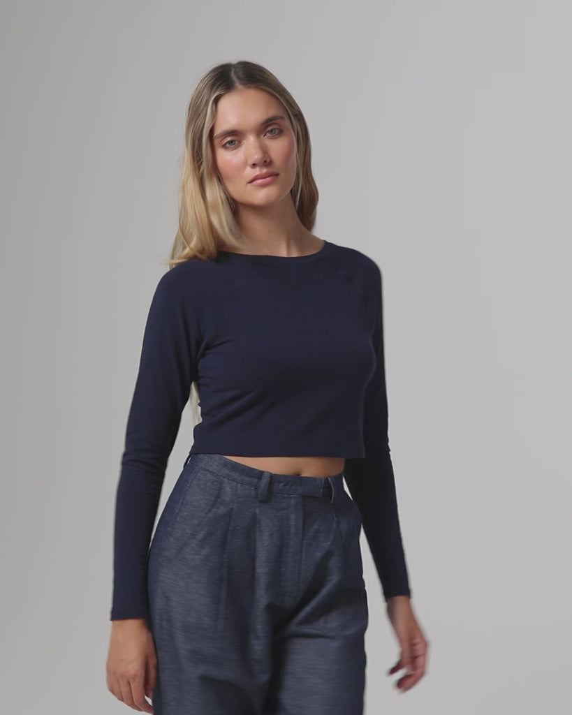 360° video of model wearing Cropped Raglan Tee (indigo blue), showing fit, drape, and movement.