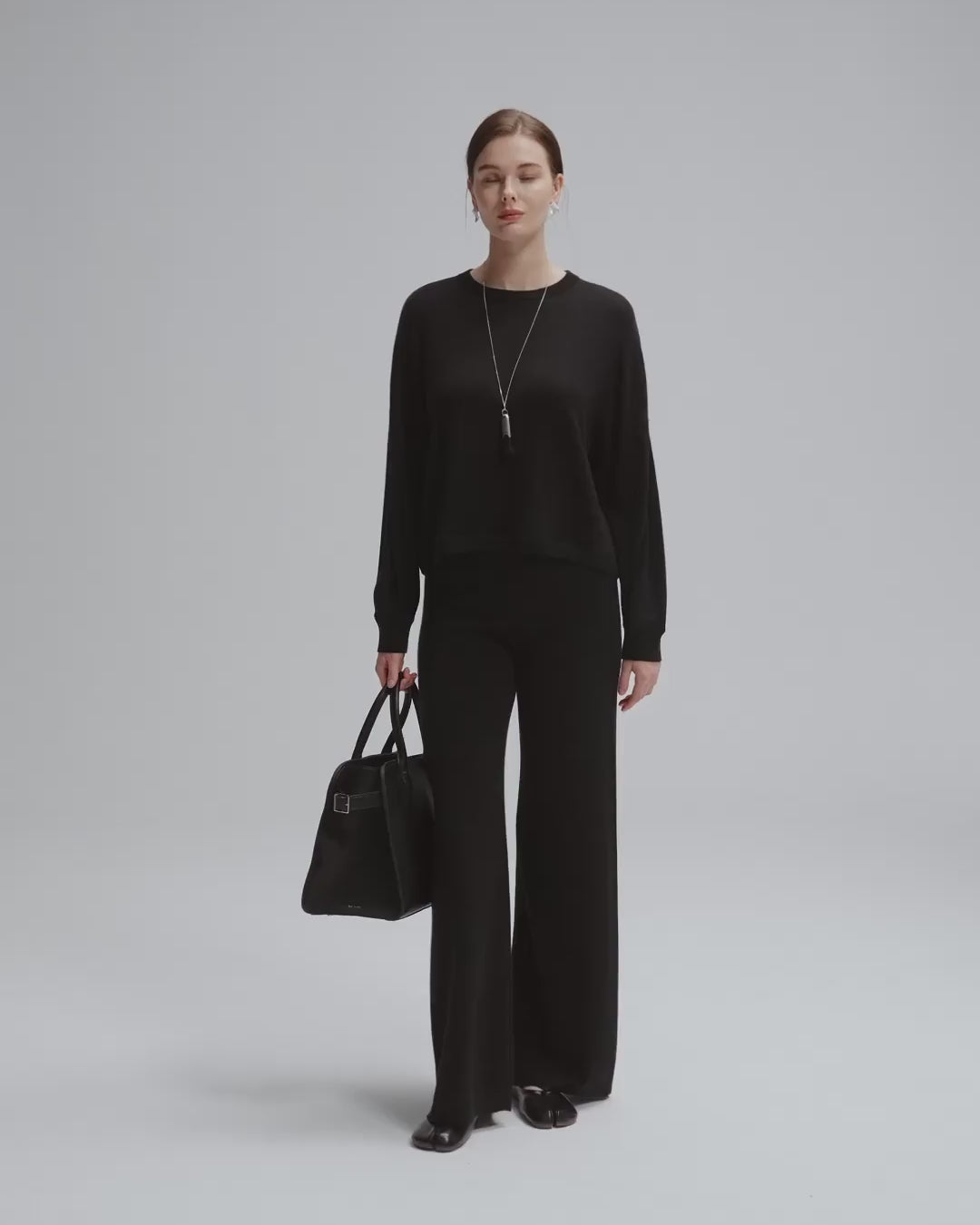 360-degree video of model wearing Nilo Knitted Hemp with Nilo Knitted Pull-On Pants Crewneck (black), showing fit and movement.