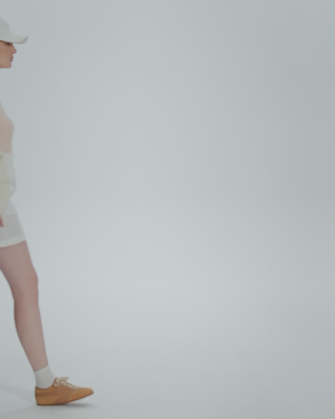 360-degree video of model wearing Classic Square Neck T-Shirt (peach), showing fit and movement.