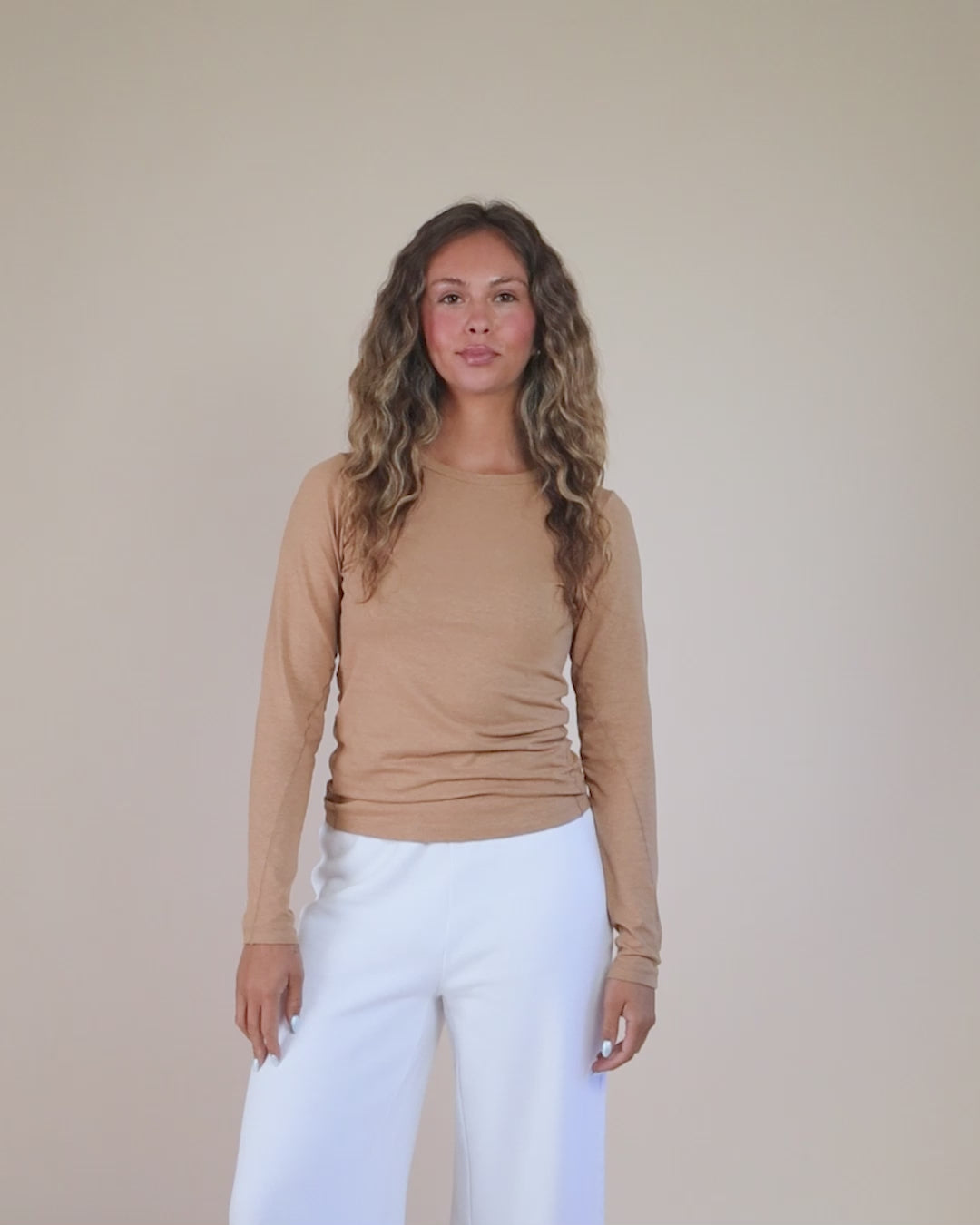 360-degree video of model wearing the Long Sleeve Tee, showing fit, drape, and silhouette from all angles.