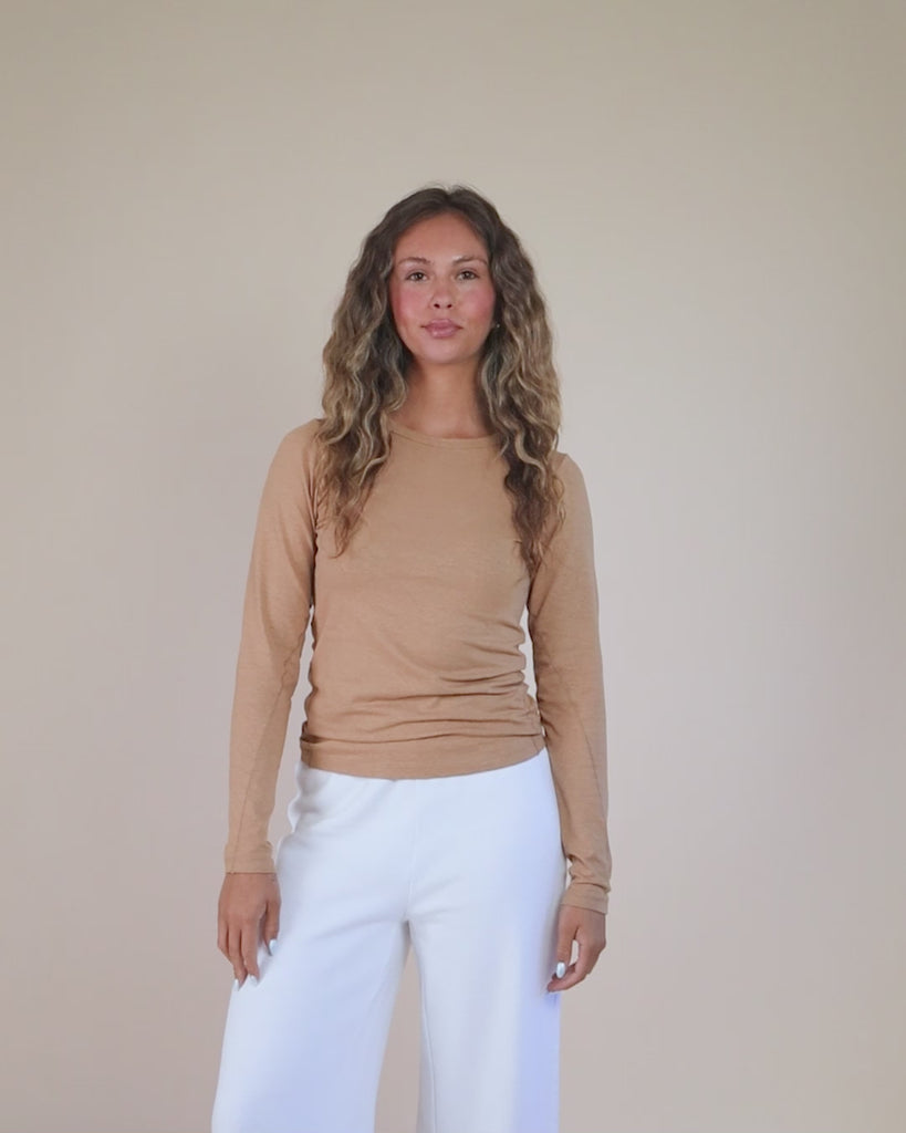 360-degree video of model wearing the Long Sleeve Tee, showing fit, drape, and silhouette from all angles.