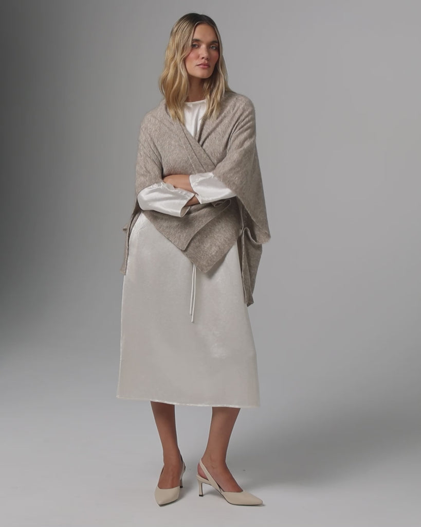 360° video of model wearing Juana Cashmere Cape (oatmeal), showing movement, drape, and layering versatility.