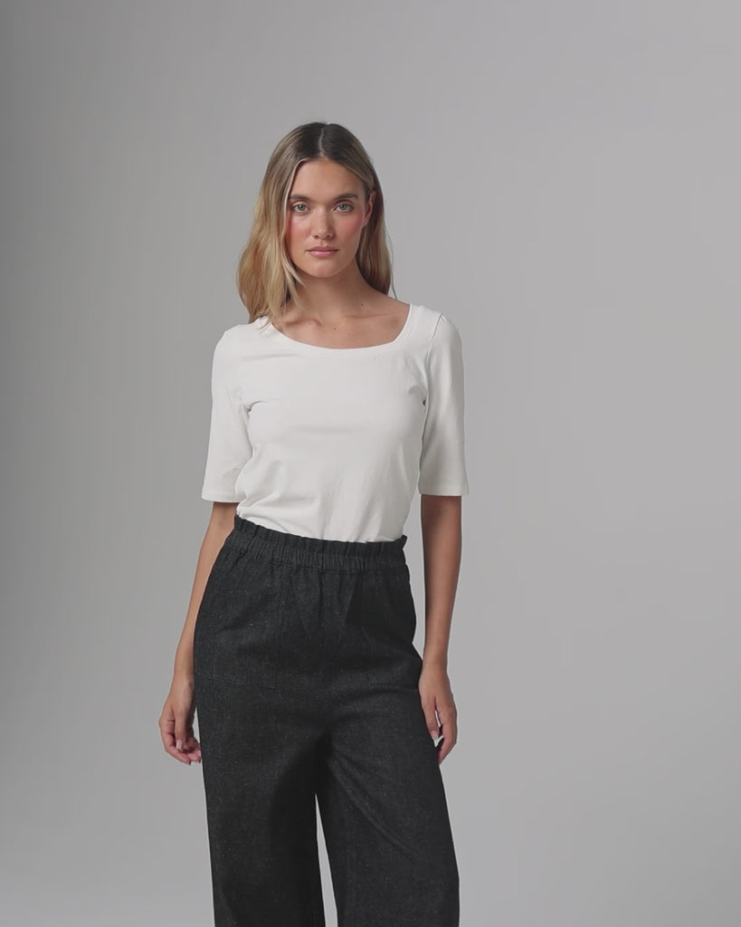 360° video of model wearing Asymmetrical Neckline Tee (white), showing fit, drape, and movement.