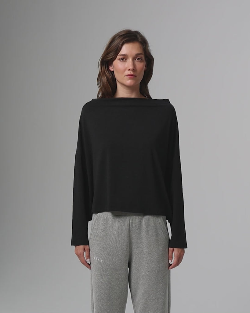 360° video of model wearing Off The Shoulder Top (black), showing fit and movement.