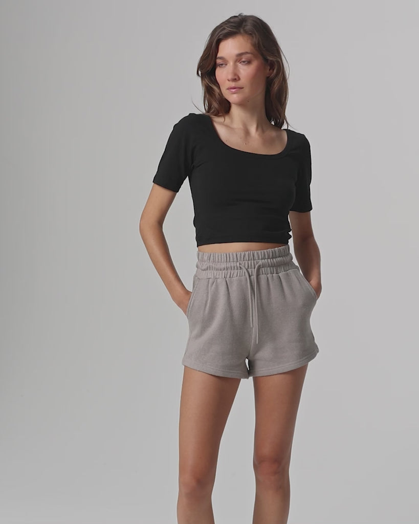 360-degree video of model wearing Classic Square Neck T-Shirt (black), showing fit and movement.