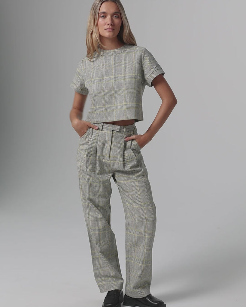 360-degree video of model wearing Plaid Theory Top (yellow-grey plaid), showing fit and movement.