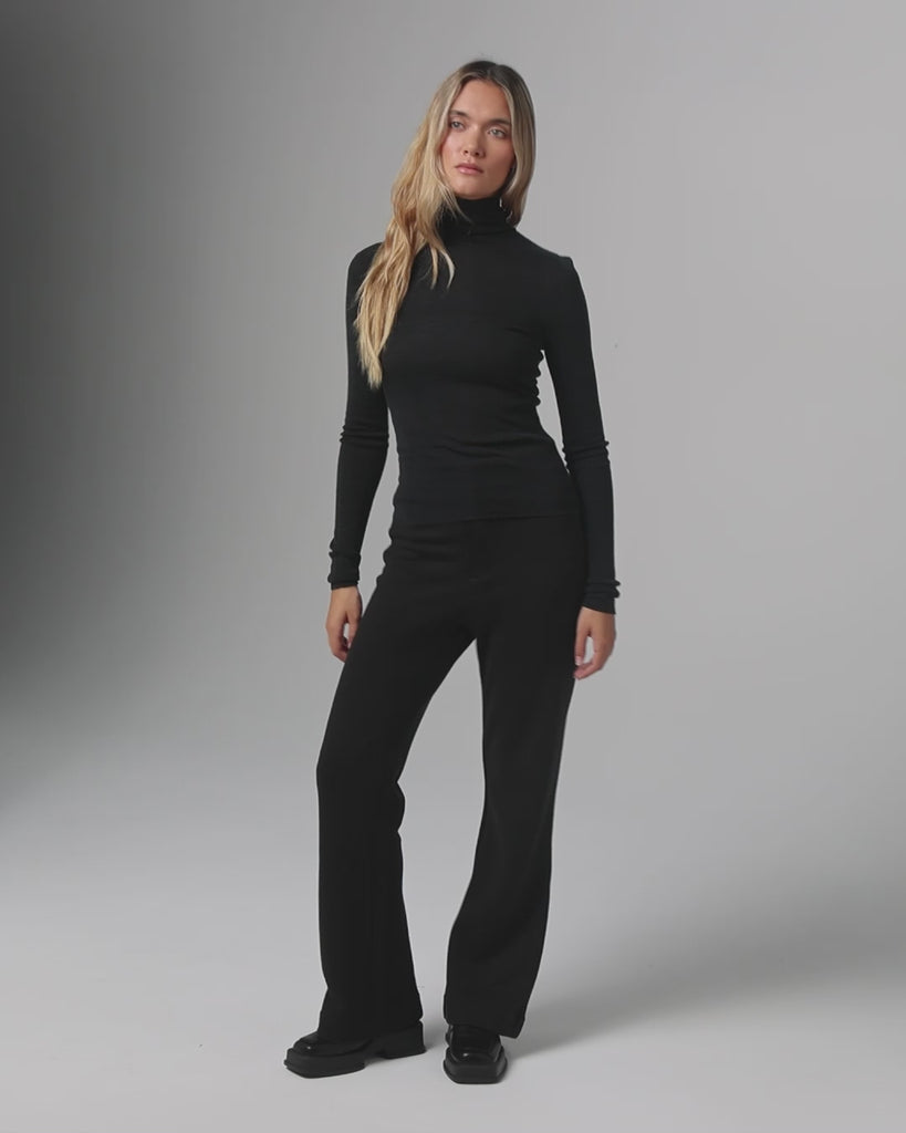 360-degree video of model wearing Juana Hemp High Rise Pants (black), highlighting full design view.