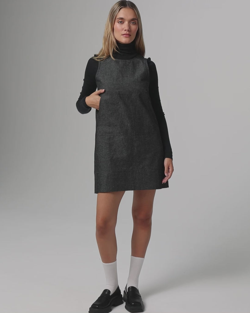 360° video of model wearing Denim Atelier Shift Dress (black denim), showing silhouette, drape, and movement.