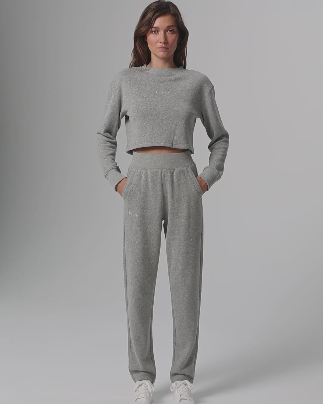 360-degree video of model wearing Off Hours Crewneck Sweater and Mid Rise Joggers (grey), showing fit, taper, and movement.